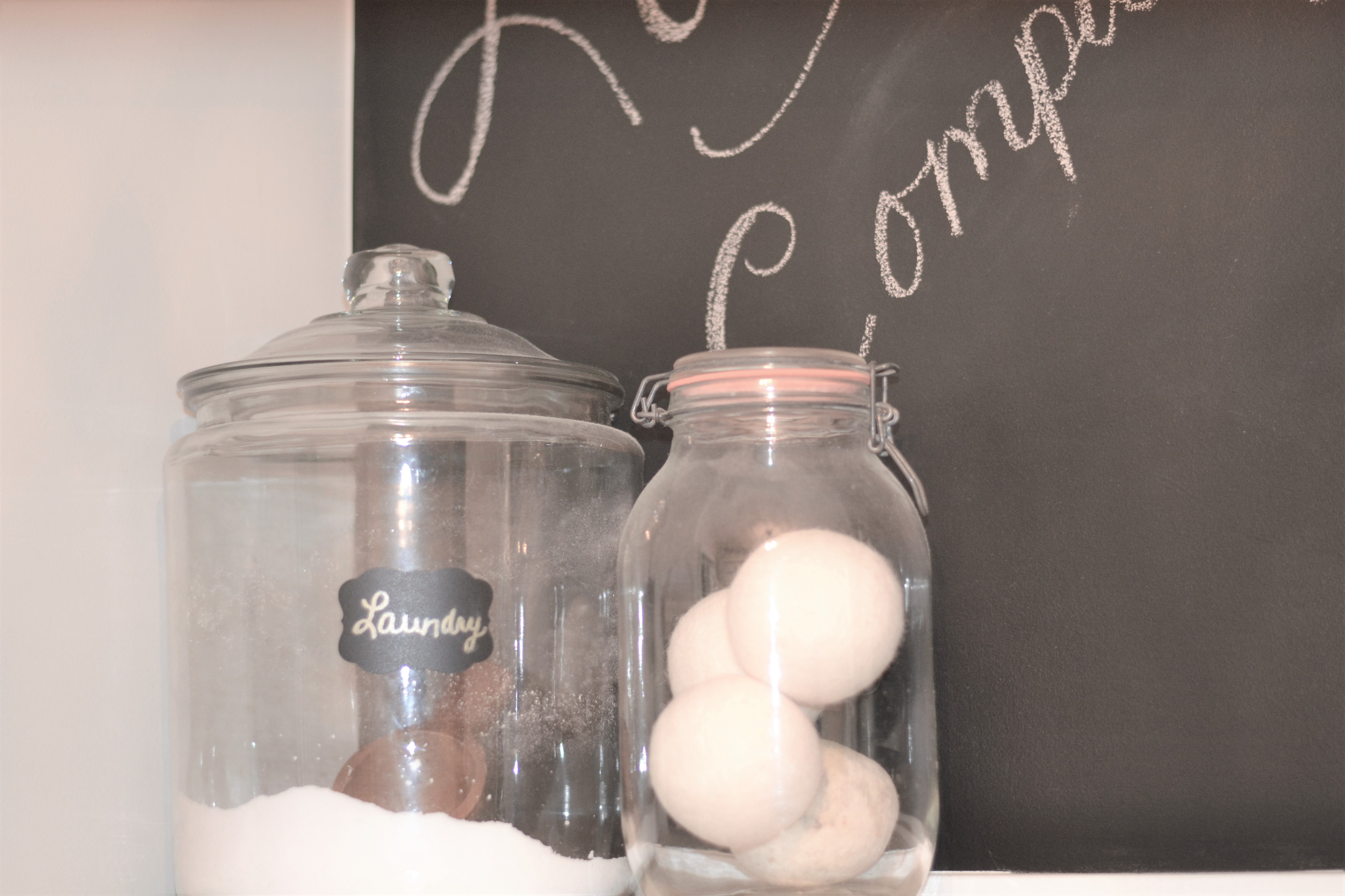 Glass containers with laundry soap and wool dryer balls